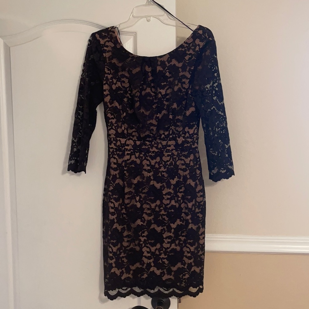 Black lace with nude lining. Long sleeve